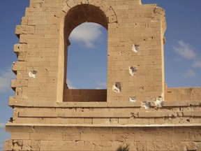 This photo taken in Sept. 2017 shows battle damage to Roman ruins in Sabratha, Libya. Rival Libyan militias have turned their guns against each other in fierce fighting that has killed dozens the past weeks and endangered Roman ruins in Sabratha. The fighting is in part fallout from an Italian-backed deal that funded militias to act as police forces to stop migrants from crossing the Mediterranean to Europe. The deal dramatically reduced migrant crossings, but sparked a backlash from other militias in the city. (Anti-ISIS Operation Room via AP)