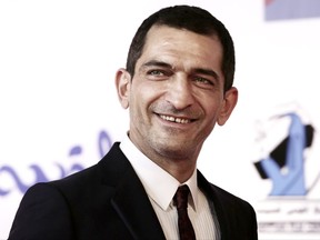 In this Sept. 22, 2017 photo, Egyptian actor Amr Waked arrives on the red carpet during the first International El Gouna Film Festival, in the Red Sea resort of el-Gouna, Egypt. An Egyptian court has convicted actor Amr Waked of "Salmon Fishing in the Yemen" fame for damaging a car parked outside his Cairo home, sentencing him to three months in prison, his lawyer said on Monday, in a case suspected of serving as punishment for the actor's opposition to President Abdel-Fattah el-Sissi's rule. (AP Photo/Nariman El-Mofty)