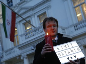FILE -- In this Jan. 16, 2017 file photo, Richard Ratcliffe, husband of imprisoned charity worker Nazanin Zaghari-Ratcliffe, poses for the media during an Amnesty International led vigil outside the Iranian Embassy in London. Ratcliffe said his wife now faces new charges and the possibility of her sentence being extended by 16 years. Ratcliffe said in a statement that his wife appeared in court on Sunday, Oct. 8, 2017, at Tehran's Evin prison and that the new charges would prevent her from seeking early release next month as allowed by Iranian law. (AP Photo/Alastair Grant, File)