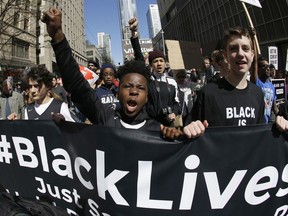FILE - In this April 15, 2017 file photo, young protesters take part in a Black Lives Matter march in Seattle. The awarding of the Sydney Peace Prize to Black Lives Matter for its work on American race issues is being hailed by local activists as a progressive step, but is also highlighting Australia's own struggles with race relations. The Sydney Peace Foundation will award its prize to Black Lives Matter for inspiring a "bold movement for change at a time when peace is threatened by growing inequality and injustice." Australian activists say such issues need to be addressed at home as well. (AP Photo/Ted S. Warren, File)