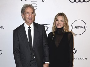 David E. Kelley, left, and Michelle Pfeiffer arrive at Variety's Power of Women Luncheon at the Beverly Wilshire hotel on Friday, Oct. 13, 2017, in Beverly Hills, Calif. (Photo by Jordan Strauss/Invision/AP)