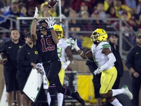 Stanford's JJ Arcega-Whiteside (19) catches a deep pass ahead of Oregon's Thomas Graham Jr. (4) during the first quarter of an NCAA college football game, Saturday, Oct. 14, 2017, in Stanford, Calif. (AP Photo/D. Ross Cameron)