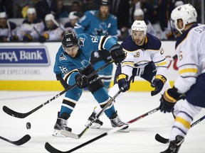 San Jose Sharks right wing Kevin Labanc (62) passes the puck down the ice against the Buffalo Sabres during the first period of an NHL hockey game, Thursday, Oct. 12, 2017, in San Jose, Calif. (AP Photo/Tony Avelar)f
