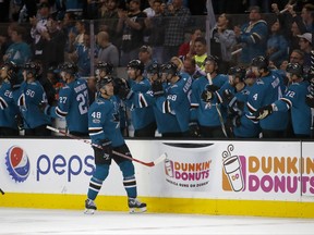 San Jose Sharks center Tomas Hertl (48) is congratulated by teammates after scoring a goal against the Montreal Canadiens during the second period of an NHL hockey game, Tuesday, Oct. 17, 2017, in San Jose, Calif. (AP Photo/Tony Avelar)
