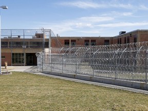 FILE - This March 28, 2017 file photo shows the Pexton Building, surrounded by barbed wire fencing, at the Minnesota Sex Offender Program in St. Peter, Minn. The U.S. Supreme Court ruled Monday, Oct. 2, 2017, that it won't hear a challenge to Minnesota's sex offender civil commitment system, which allows people who have been deemed sexually dangerous to be committed to a treatment facility for an indefinite period of time. (AP Photo/Jim Mone File)