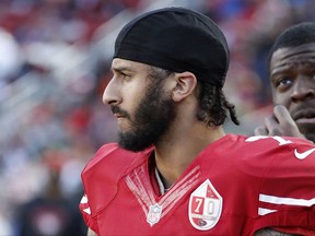 FILE - In this Jan. 1, 2017 file photo San Francisco 49ers quarterback Colin Kaepernick stands on the sideline during an NFL football game in Santa Clara, Calif. Wisconsin Gov. Scott Walker sent a letter Monday Oct. 16, 2017 to NFL Commissioner Roger Goodell and Players Association Executive Director DeMaurice Smith saying he believes players are showing disrespect for the flag and veterans. Former 49ers quarterback Colin Kaepernick started the protests last season when he refused to stand during the anthem to protest racial inequality and police brutality. (AP Photo/Tony Avelar File)