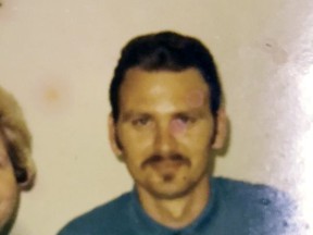 This undated photo provided by the Downey family shows John Downey posing for a photo at United States Penitentiary, Leavenworth in Leavenworth, Kan. A new FBI technique for identifying bodies using low-quality fingerprints enabled authorities to identify human remains found in Des Moines, Iowa, in 1984, as Downey. Nearly 200 other bodies across the country have been identified through the FBI effort. (Downey family via AP)