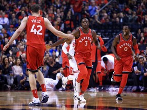 Toronto Raptors forward OG Anunoby (centre) celebrates his first NBA basket against the Chicago Bulls on Oct. 19.