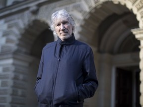Musician Roger Waters stands on the steps of an Ontario Court Hose as he joins supporters of Ecuadorian indigenous groups who are appearing in court in an attempt to secure payment of a court order in Toronto on Tuesday October 10, 2017. The Ecuador indigenous nations are protesting against Chevron oil company's pollution of their Amazon rainforest home. THE CANADIAN PRESS/Chris Young