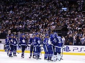 Toronto Maple Leafs centre William Nylander (29) and goalie Frederik Andersen (31) embrace as they celebrate the team's 8-5 victory against the New York Rangers after third period NHL hockey action in Toronto on Saturday, October 7, 2017. THE CANADIAN PRESS/Cole Burston