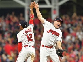 Francisco Lindor, left, and Jay Bruce of the Cleveland Indians exchange high-fives after the Indians 4-0 win over the New York Yankees in Game 1 of their ALDS Thursday at Progressive Field in Cleveland. Game 2 is Friday in Cleveland.