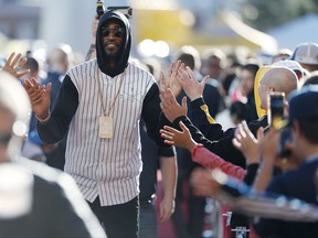Denver Nuggets guard Will Barton walks the red carpet past fans on the way into the arena for the team's opening home NBA basketball game of the regular season against the Sacramento Kings, Saturday, Oct. 21, 2017, in Denver. (AP Photo/David Zalubowski)