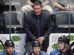 Colorado Avalanche coach Jared Bednar talks to his players during the first period of an NHL hockey game against the St. Louis Blues on Thursday, Oct. 19, 2017, in Denver. (AP Photo/David Zalubowski)
