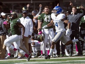 Colorado State running back Dalyn Dawkins(1) gets away from Air Force safety James Jones IV(4) during a touchdown run in an NCAA college football game at CSU Stadium in Fort Collins, Colo, Saturday, Oct. 28, 2017. (Austin Humphreys/The Coloradoan via AP)