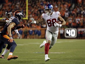 New York Giants tight end Evan Engram (88) runs upfield during the first half of an NFL football game against the Denver Broncos, Sunday, Oct. 15, 2017, in Denver. (AP Photo/Jack Dempsey)