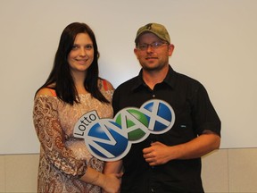 Robin Walker, left, and Brett McCoy, of Yellowhead County, pose for a portrait in this undated handout photo. The couple won a $60 million dollar prize in the Lotto Max draw, the largest lottery prize ever won in Alberta. THE CANADIAN PRESS/HO-Alberta Gaming and Liquor Commission, *MANDATORY CREDIT*