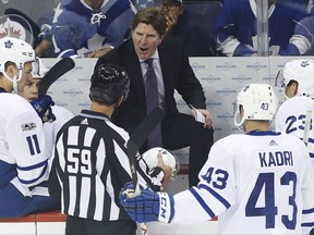 Toronto Maple Leafs head coach Mike Babcock has words with an official for an illegal equipment penalty during first period NHL action against Winnipeg Jets in Winnipeg on October 4, 2017. Despite watching his team win 7-2 in Winnipeg to kick off the season, Mike Babcock wants improvements in Saturday's home opener against the New York Rangers.The Maple Leafs coach reeled off Toronto's eight penalties Wednesday night against the Jets, a docket that ranged from too many men on the ice and an equipment violation to four high-sticking calls. THE CANADIAN PRESS/John Woods