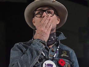 Gord Downie blows a kiss to the audience during a ceremony honouring the Canadian singer at the AFN Special Chiefs assembly in Gatineau, Que., Tuesday, December 6, 2016. Among the tweets of tributes from fans of Downie were some that appeared less than heartfelt - messages from corporate brands including Hudson's Bay and Chevrolet Canada. Downie died Tuesday night after a public battle with glioblastoma, an aggressive form of brain cancer. THE CANADIAN PRESS/Adrian Wyld
