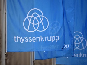 Flags in front of the headquarters of steel giant ThyssenKrupp show the company's new logo in Essen, Germany, on Thursday, Nov, 19, 2015. One of the country's pre-eminent elevator companies has been fined $500,000 for five violations of Ontario's safety rules. THE CANADIAN PRESS/AP Photo/Martin Meissner