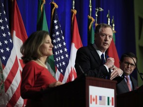 United States Trade Representative Robert Lighthizer, center, with Canadian Minister of Foreign Affairs Chrystia Freeland, left, and Mexico's Secretary of Economy Ildefonso Guajardo Villarrea, right, speaks during the conclusion of the fourth round of negotiations for a new North American Free Trade Agreement (NAFTA) in Washington, Tuesday, October 17, 2017. THE CANADIAN PRESS/AP-Manuel Balce Ceneta