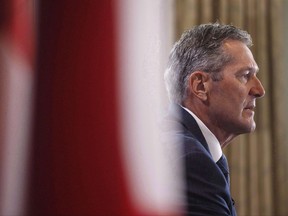 Manitoba Premier Brian Pallister speaks at a press conference during the Council of Federation meetings, in Edmonton on Tuesday, July 18, 2017. Manitoba's Progressive Conservative government will announce a carbon tax of $25 a tonne Friday - to be implemented sometime next year - and keep it at that rate, a government source familiar with the file confirmed to The Canadian Press. THE CANADIAN PRESS/Jason Franson