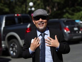 B.C. Green MLA Adam Olsen leaves Government House after Premier John Horgan was sworn-in as Premier in Victoria, B.C., on Tuesday, July 18, 2017. Transportation spokesman Adam Olsen says the arrival of ride sharing to B.C. has been stalled by both the Liberals and NDP. THE CANADIAN PRESS/Chad Hipolito