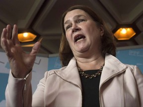 Indigenous Services Minister Jane Philpott delivers a speech in Ottawa on September 27, 2017. Indigenous Services Minister Jane Philpott says the Liberal government expects to reach a settlement in the "near future" with a First Nations family that's been battling the federal government to pay for school bus service for a child with cerebral palsy. Philpott called it "unconscionable" that the family been fighting for more than a decade to get bus access for 15-year-old Noah Buffalo-Jackson, who goes to school in the Alberta city of Wetaskiwin, about 35 minutes from his community of Montana First Nation. THE CANADIAN PRESS/Adrian Wyld