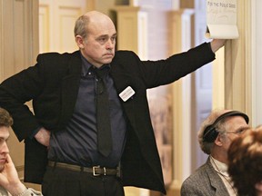 Actor John Dunsworth listens to a speaker at a news conference in Halifax on April 12, 2005