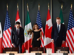Minister of Foreign Affairs Chrystia Freeland meets for a trilateral meeting with Mexico's Secretary of Economy Ildefonso Guajardo Villarreal, left, and Ambassador Robert E. Lighthizer, United States Trade Representative, during the final day of the third round of NAFTA negotiations at Global Affairs Canada in Ottawa on Wednesday, Sept. 27, 2017. The NAFTA countries haven't broken up. But they are publicly bickering. They are delaying their next get-together date. And they appear to have agreed they won't be resolving their differences by the end of this year. THE CANADIAN PRESS/Sean Kilpatrick