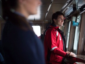 Prime Minister Justin Trudeau stands on the bridge of the Canadian Coast Guard ship Sir Wilfrid Laurier, during a tour of the harbour in Vancouver, B.C., on Monday November 7, 2016. The Trudeau government is promising a much-needed infusion of cash for the Canadian Coast Guard and federal fisheries department, which internal documents show have been struggling with funding shortfalls for years.  THE CANADIAN PRESS/Darryl Dyck