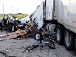 A fatal collision on highway 401 in Chatham-Kent, Ontario on July 30, 2017 is shown in this police handout image. Provincial police say they're putting transport truck drivers "on notice" after laying charges in three horrific collisions involving big rigs that claimed the lives of six people.THE CANADIAN PRESS/HO-Ontario Provincial Police