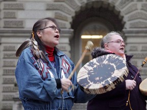 Marcia Brown Martel (left) is seen outside court in Toronto on Thursday, Dec. 1, 2016. The Canadian Press has learned that the federal government has agreed to pay hundreds of millions of dollars to Indigenous survivors of the '60s Scoop.THE CANADIAN PRESS/Colin Perkel