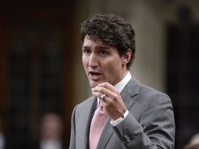Prime Minister Justin Trudeau rises during question period in the House of Commons on Parliament Hill in Ottawa on October 4, 2017. Justin Trudeau will belatedly honour his campaign promise to cut the small business tax rate to nine per cent as his government scrambles to undo the damage from weeks of controversy over proposed tax reforms for private corporations. THE CANADIAN PRESS/Adrian Wyld