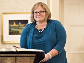 Sarah Hoffman, newly appointed Alberta Deputy Premier is sworn in, in Edmonton Alta, on Monday February 2, 2016. Canada's health ministers are looking at ways of working together, including an electronic prescription database, to fight the growing crisis in opioid addictions. THE CANADIAN PRESS/Jason Franson