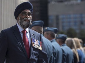 Defence Minister Harjit Sajjan displays his service medals as he leaves a ceremony in which the Royal Canadian Air Force were presented with new ceremonial flags in Toronto on Friday, September 1, 2017. The Trudeau government is taking its time deciding how to protect Canada from ballistic missiles as part of a larger review of North American defences, Defence Minister Harjit Sajjan revealed Wednesday. THE CANADIAN PRESS/Chris Young