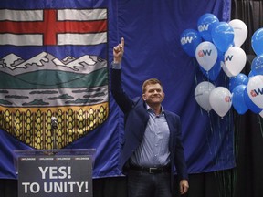 Wildrose leader Brian Jean celebrates the yes vote during the Unity Vote at the Wildrose Special General Meeting in Red Deer Alta, on Saturday, July 22, 2017. Former Wildrose leader Brian Jean will not be taking an active role in the United Conservative Party opposition at the Alberta legislature - at least for now. THE CANADIAN PRESS/Jason Franson