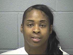 This undated photo provided by the Will County Sheriff's Office shows Iesha Stanciel. Stanciel is accused of urging Facebook followers to kill a gang member-turned-FBI mole for his role in a sting that put an associate of hers behind bars on charges he tried to sell semi-automatic rifles stolen from a freight train that had stopped overnight at a Norfolk Southern yard on Sept. 18, 2016, in Chicago. Stanciel faces federal cyberstalking charges for the threats, as well as a gun charge after she was arrested carrying a bag containing one of the brand new AR 15-type assault rifles (Will County Sheriff's Office via AP)