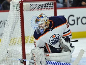 Edmonton Oilers goalie Cam Talbot (33) makes a save during the first period of an NHL hockey game against the Chicago Blackhawks Thursday, Oct. 19, 2017, in Chicago. (AP Photo/Paul Beaty)
