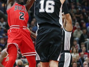 Chicago Bulls guard Jerian Grant (2) looks to pass the ball against San Antonio Spurs forward Pau Gasol (16) during the first half of an NBA basketball game, Saturday, Oct. 21, 2017, in Chicago. (AP Photo/Kamil Krzaczynski)