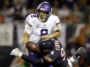 Chicago Bears outside linebacker Leonard Floyd (94) tackles Minnesota Vikings quarterback Sam Bradford (8) for safety during the first half of an NFL football game, Monday, Oct. 9, 2017, in Chicago. (AP Photo/Darron Cummings)