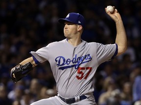 Los Angeles Dodgers starting pitcher Alex Wood throws during the first inning of Game 4 of baseball's National League Championship Series against the Chicago Cubs, Wednesday, Oct. 18, 2017, in Chicago. (AP Photo/Matt Slocum)