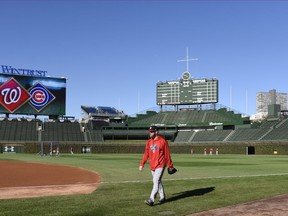 Washington Nationals starting pitcher Stephen Strasburg (37) walks on the field during baseball practice at Wrigley Field, Sunday, Oct. 8, 2017, in Chicago. Game 3 of the National League Division Series between the Nationals and the Chicago Cubs is Monday. (AP Photo/David Banks)
