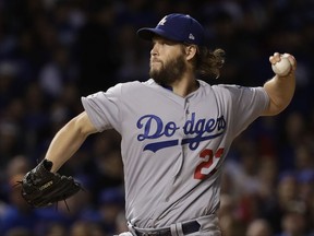 Los Angeles Dodgers starting pitcher Clayton Kershaw (22) throws during the first inning of Game 5 of baseball's National League Championship Series against the Chicago Cubs, Thursday, Oct. 19, 2017, in Chicago. (AP Photo/Matt Slocum)