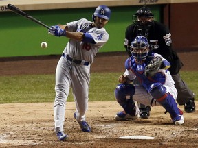 Los Angeles Dodgers' Andre Ethier (16) hits a single during the sixth inning of Game 3 of baseball's National League Championship Series against the Chicago Cubs, Tuesday, Oct. 17, 2017, in Chicago. (AP Photo/Charles Rex Arbogast)