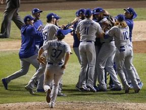 The Los Angeles Dodgers players celebrate after Game 5 of baseball's National League Championship Series against the Chicago Cubs, Thursday, Oct. 19, 2017, in Chicago. The Dodgers won 11-1 to win the series and advance to the World Series. (AP Photo/Charles Rex Arbogast)