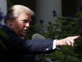 President Donald Trump points to a reporter to ask a question during a media availability in the Rose Garden with Senate Majority Leader Mitch McConnell of Ky., after their meeting at the White House, Monday, Oct. 16, 2017, in Washington. (AP Photo/Alex Brandon)