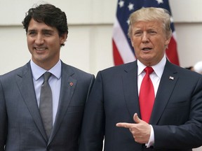 President Donald Trump and Canadian Prime Minister Justin Trudeau poses for a photo as Trudeau arrives at the White House in Washington, Wednesday, Oct. 11, 2017. (AP Photo/Carolyn Kaster)
