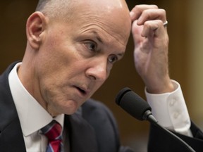 Former chairman and CEO of Equifax Richard F. Smith, scratches his head as he testifies before the Digital Commerce and Consumer Protection Subcommittee of the House Commerce Committee on Capitol Hill in Washington, Tuesday, Oct. 3, 2017. AP Photo/Carolyn Kaster)