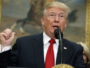 President Donald Trump speaks before signing an executive order on health care in the Roosevelt Room of the White House, Thursday, Oct. 12, 2017, in Washington.