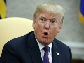 President Donald Trump speaks during a meeting with Governor Ricardo Rossello of Puerto Rico in the Oval Office of the White House, Thursday, Oct. 19, 2017, in Washington. (AP Photo/Evan Vucci)